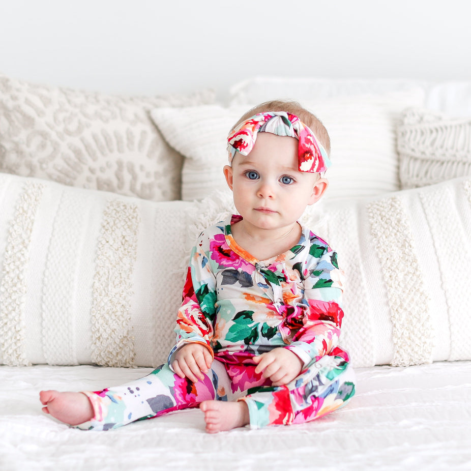 Posh-Peanut-Viscose-Bamboo-Stay-dry-fabric-reliably-chic-and-perfectly-practical-uniquely-designed-of-a-kind-ruffled romper one piece in fuchsia wild flower