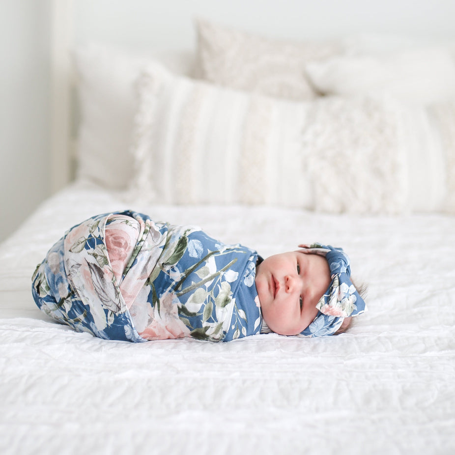Swaddle-your-baby-soft-organic-bamboo-fibers-keep-baby-dry-and-comfy in blue rose