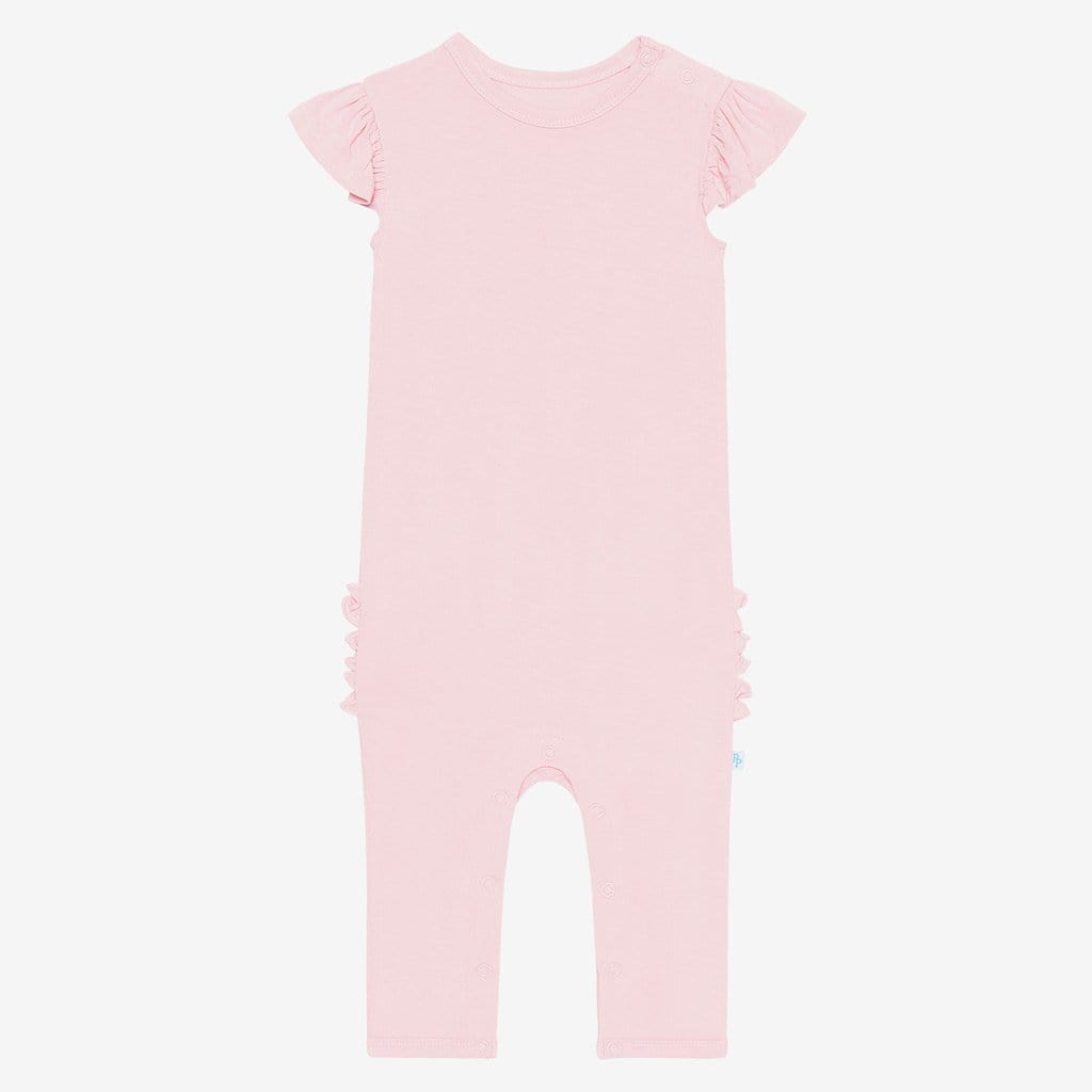 Front of blush ruffled cap sleeve romper