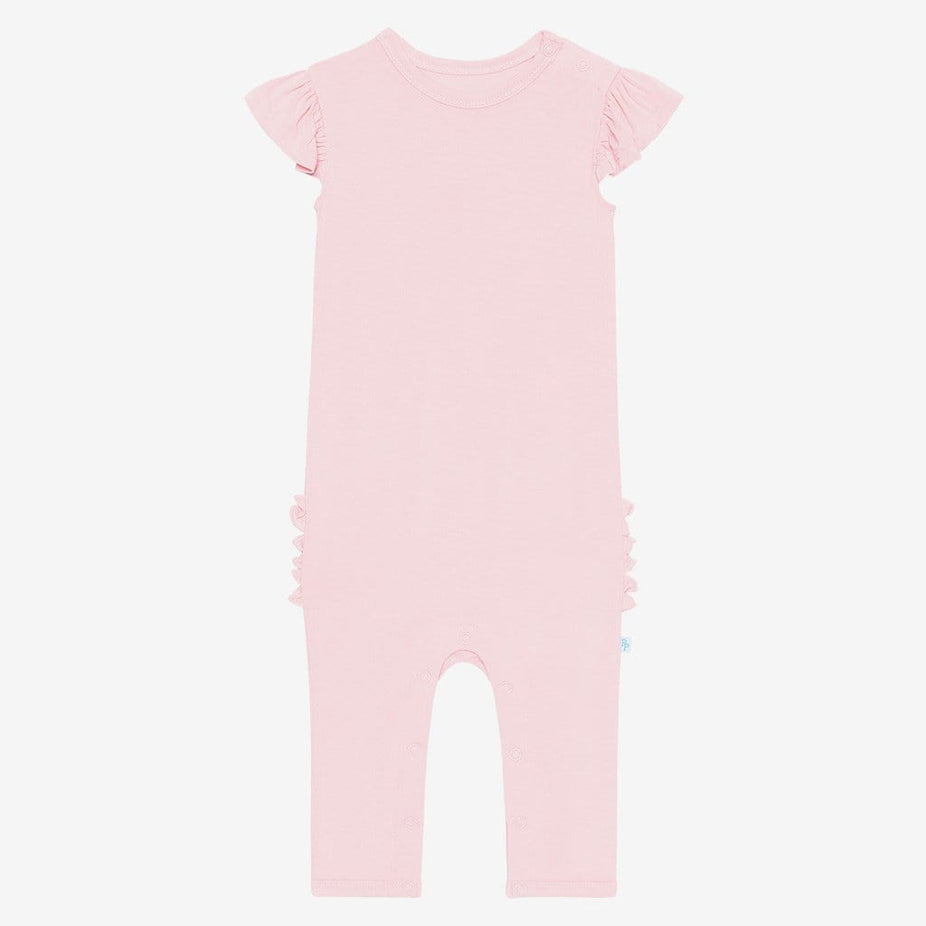 Front of blush ruffled cap sleeve romper