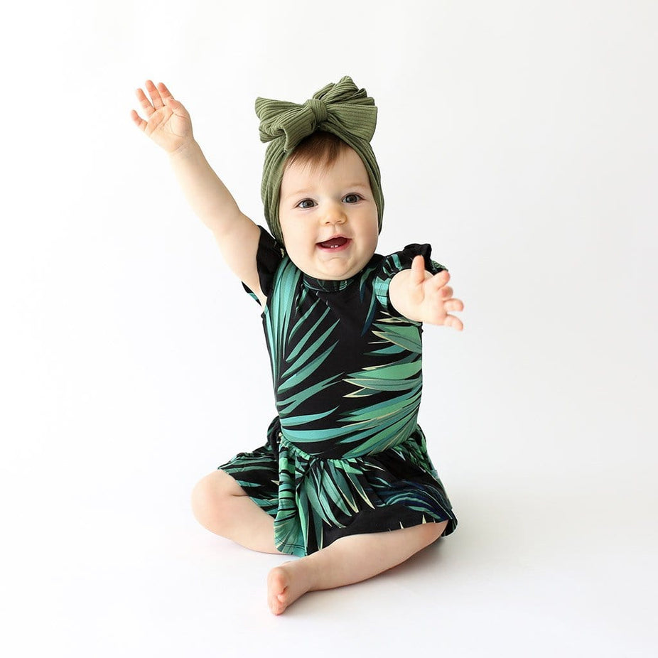 Baby wearing Cooper Ruffled Cap Sleeve Twirl Skirt Bodysuit
