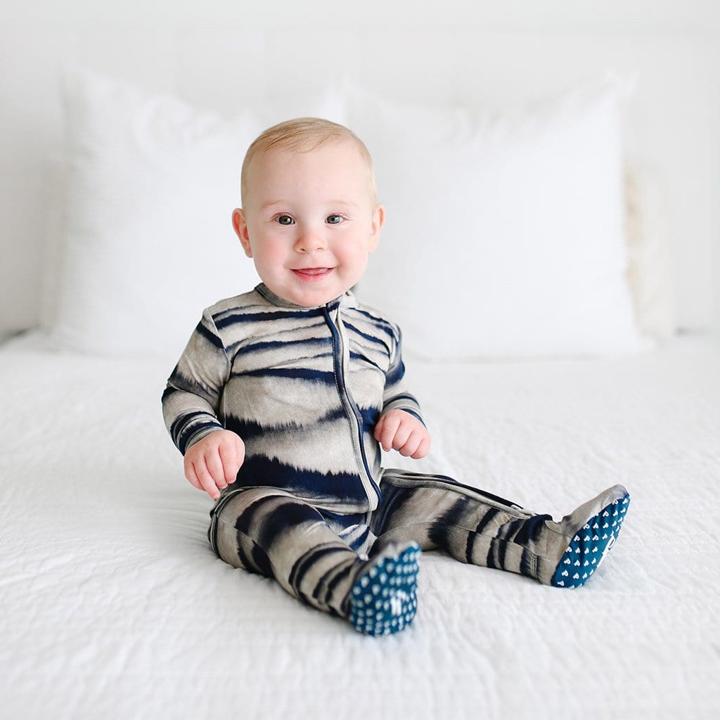 Baby sitting wearing Rowan Footie Zippered One Piece