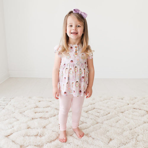 Toddler wearing Matryoshka Ruffled Cap Sleeve Henley Peplum Legging Set