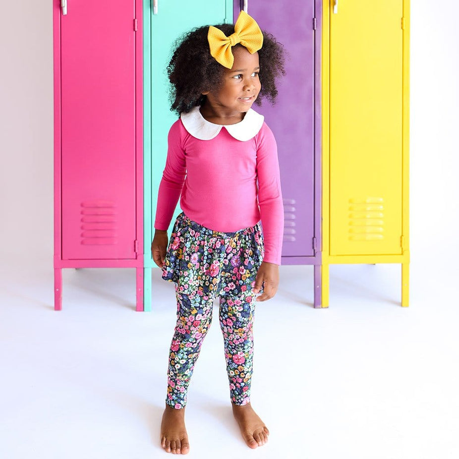 Toddler with yellow ribbon wearing Scarlet Long Sleeve Collared Top Skirted Legging Set