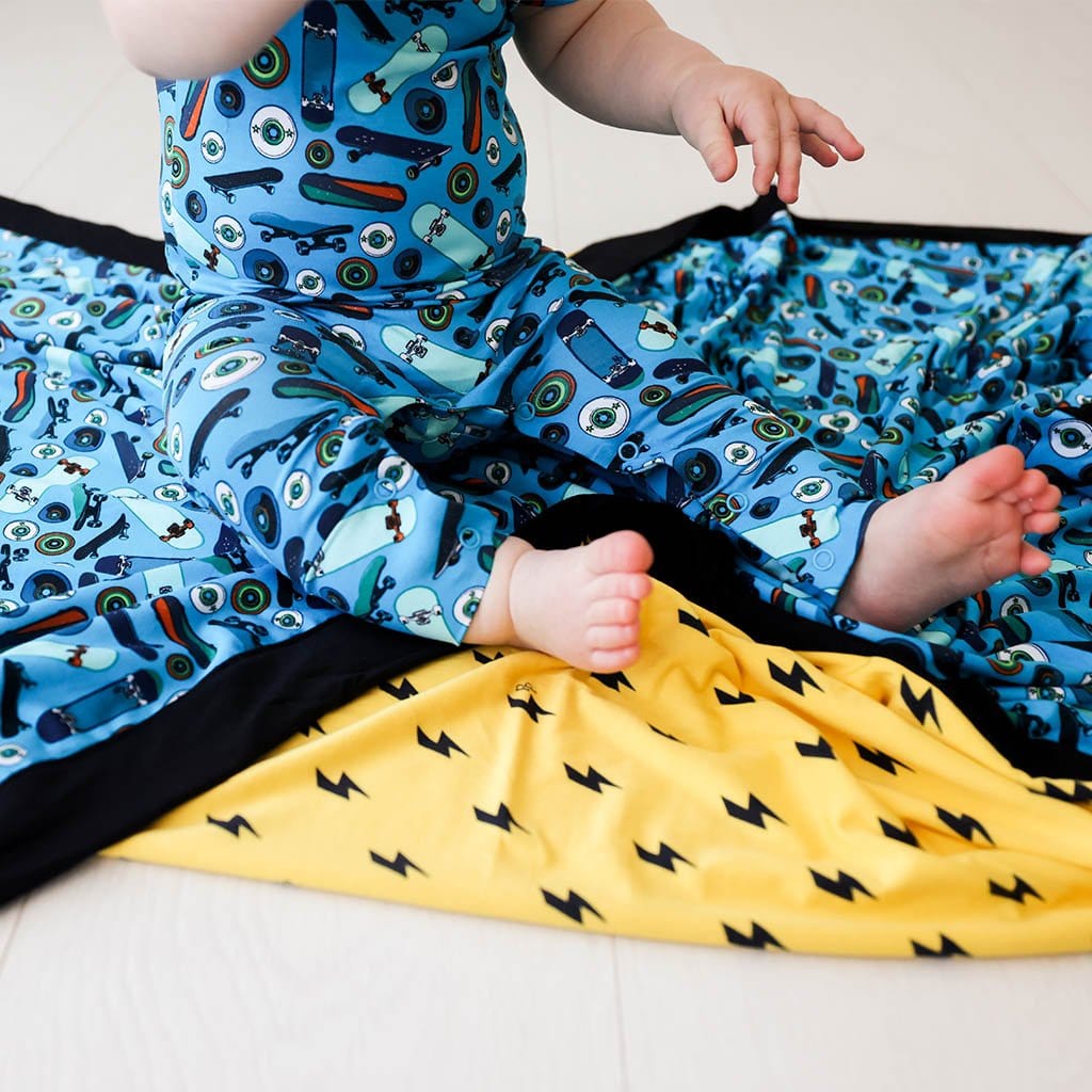 Baby on Cole & Lightning Bolt Luxe Patoo in skateboard print