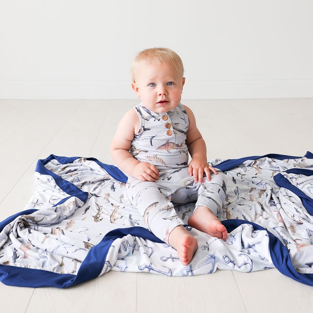 Baby sitting on Maverick & Anchors Away Luxe Patoo