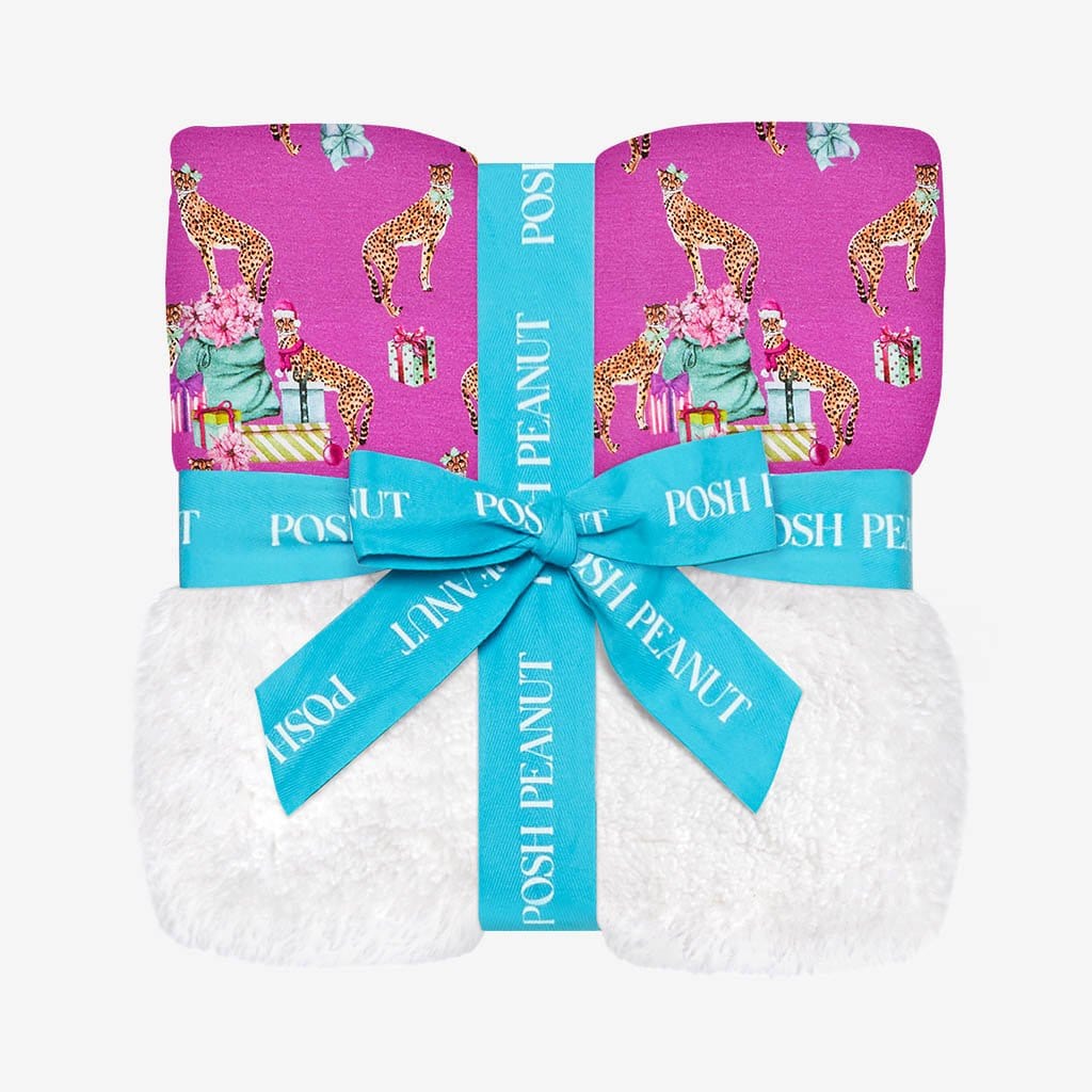 Folded and tied with a ribbon Plush Patoo™ Leopard Baby Blanket | Keana