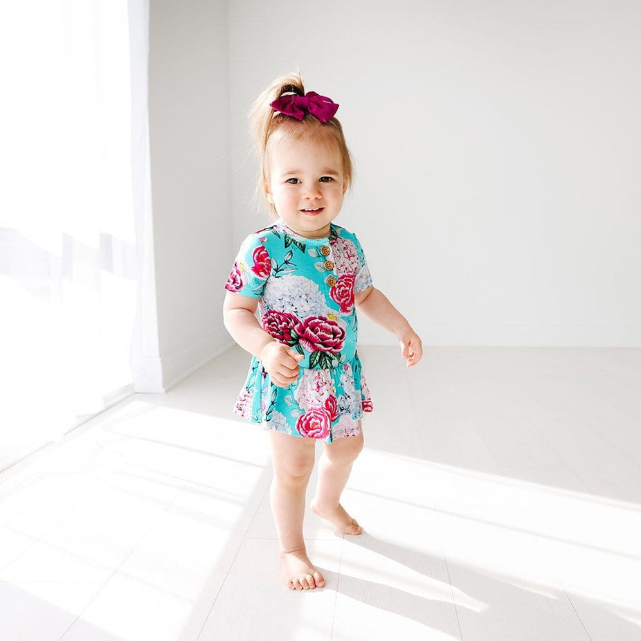 Baby on floral Eloise Short Sleeve Henley Twirl Skirt Bodysuit