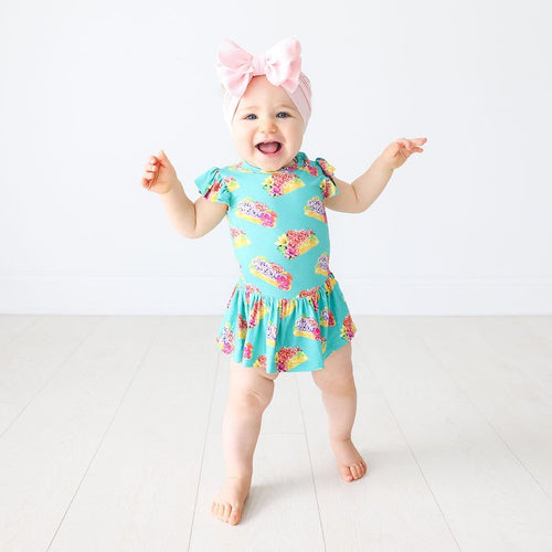Baby wearing Valentina Ruffled Cap Sleeve Twirl Skirt Bodysuit in flower print