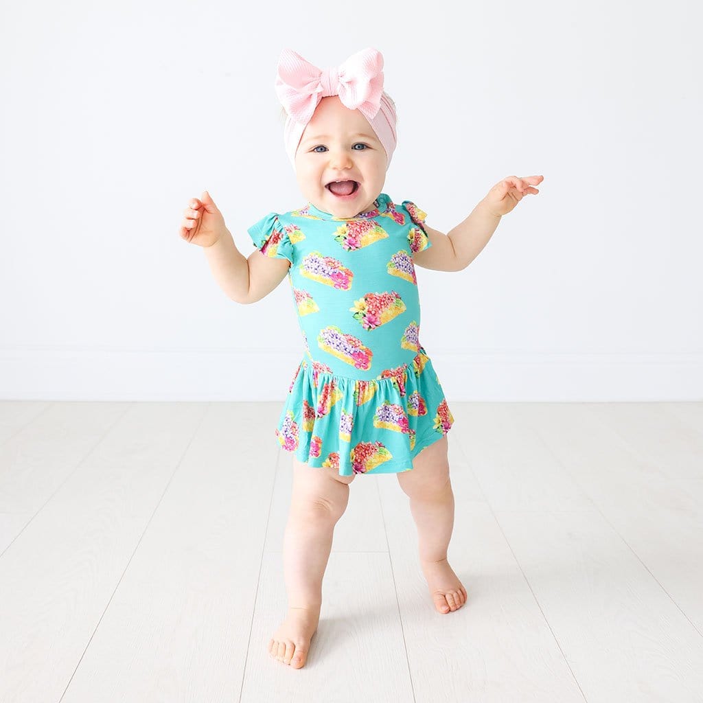 Baby wearing Valentina Ruffled Cap Sleeve Twirl Skirt Bodysuit in flower print
