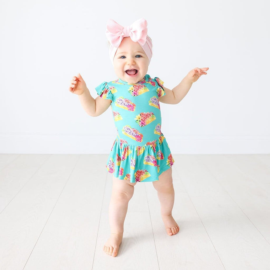 Baby wearing Valentina Ruffled Cap Sleeve Twirl Skirt Bodysuit in flower print