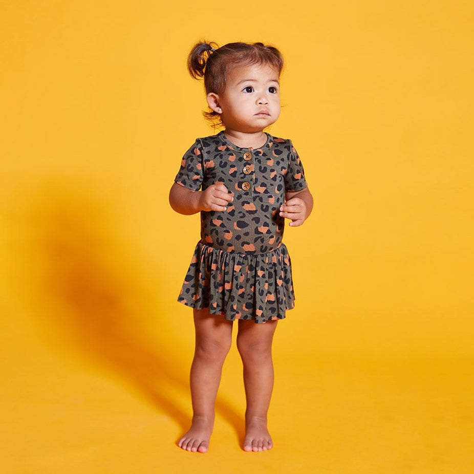 Baby wearing Eli Short Sleeve Henley Twirl Skirt Bodysuit