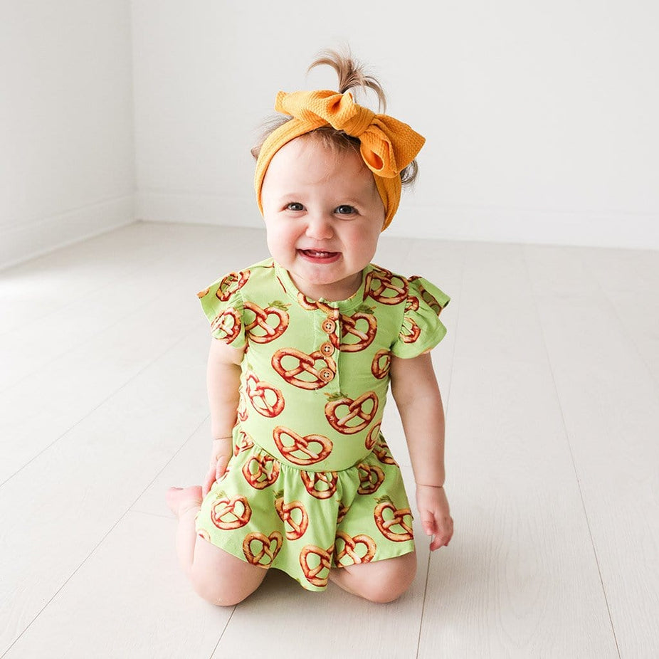Baby on Pretzel Ruffled Cap Sleeve Henley Twirl Skirt Bodysuit