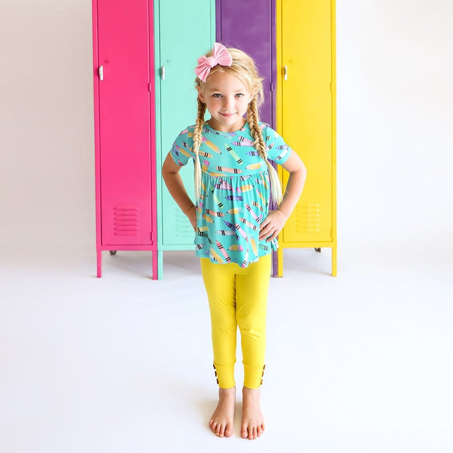 Girl wearing Back to School Short Sleeve Peplum Legging Set