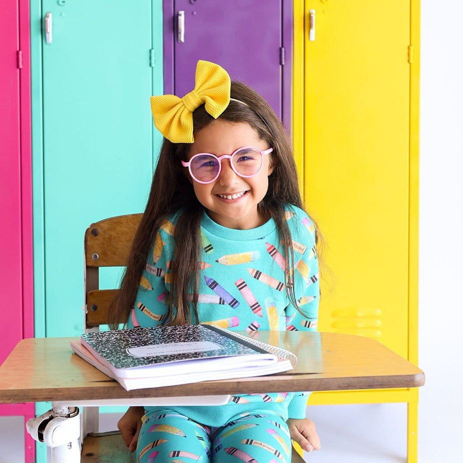 Toddler in yellow ribbon wearing Back to School Long Sleeve Sweatshirt