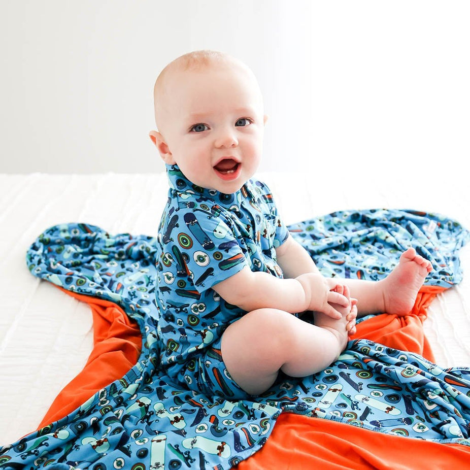 Baby wearing Cole & Orange Patoo in skateboard print