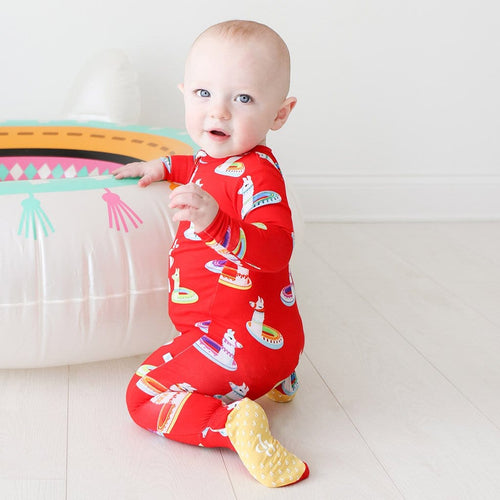 Baby wearing Emilio Footie Zippered One Piece in red print