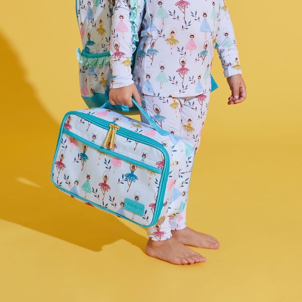 Toddler holding Noel Lunch Bag