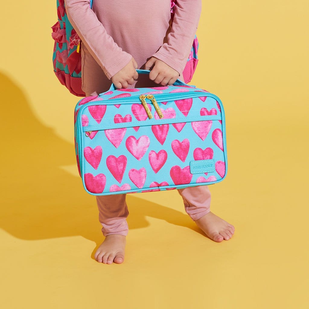 Toddler holding Queen of Hearts Lunch Bag
