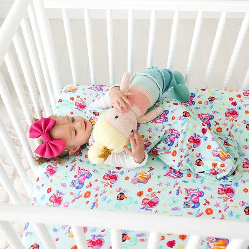 Baby cuddling stuff toy wearing Kai Sleeveless Ruffled Sleep Bag 1.0 Tog