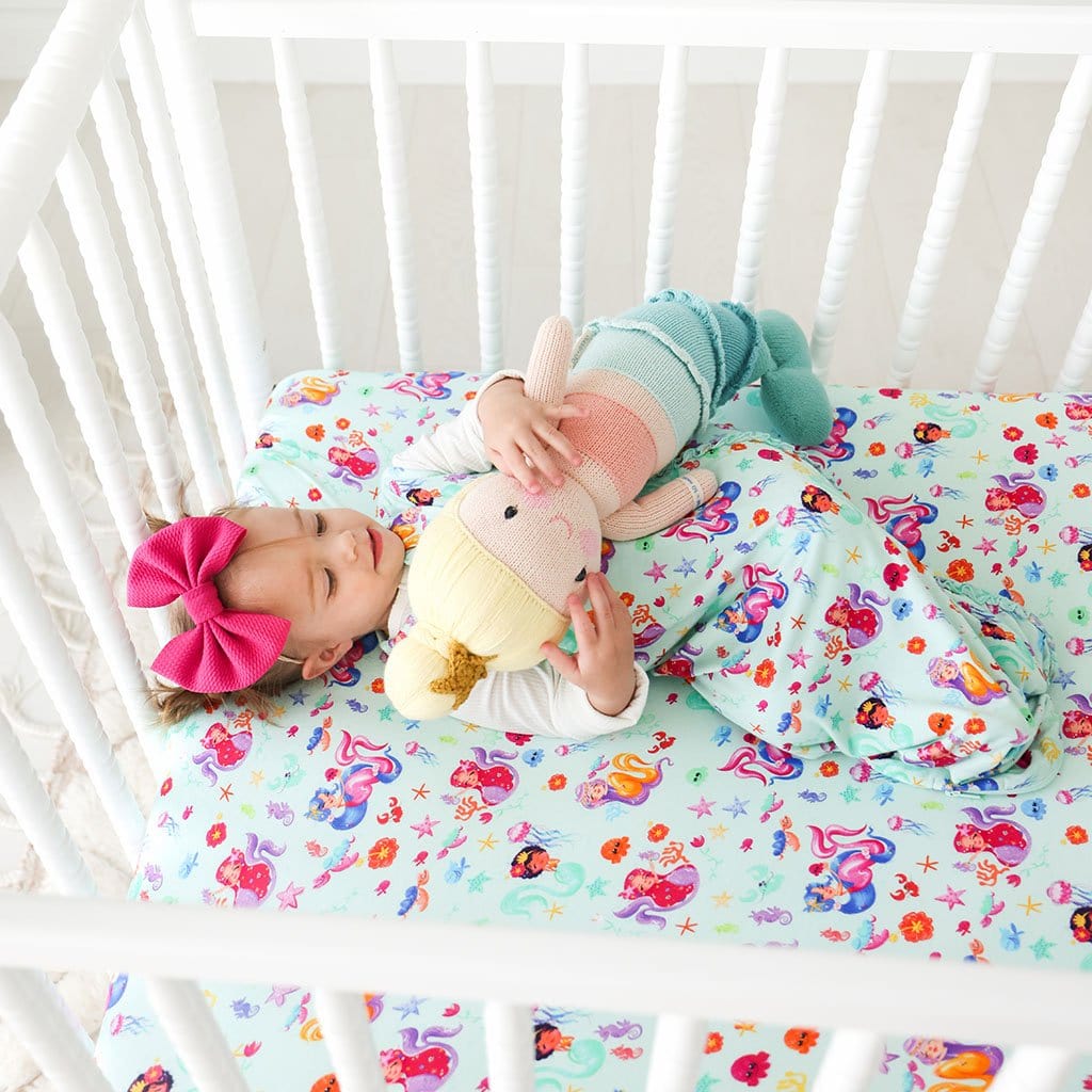 Baby cuddling stuff toy wearing Kai Sleeveless Ruffled Sleep Bag 1.0 Tog