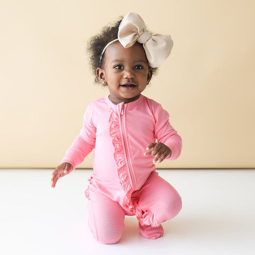 Baby wearing Blush Rose Footie Ruffled Zippered One Piece