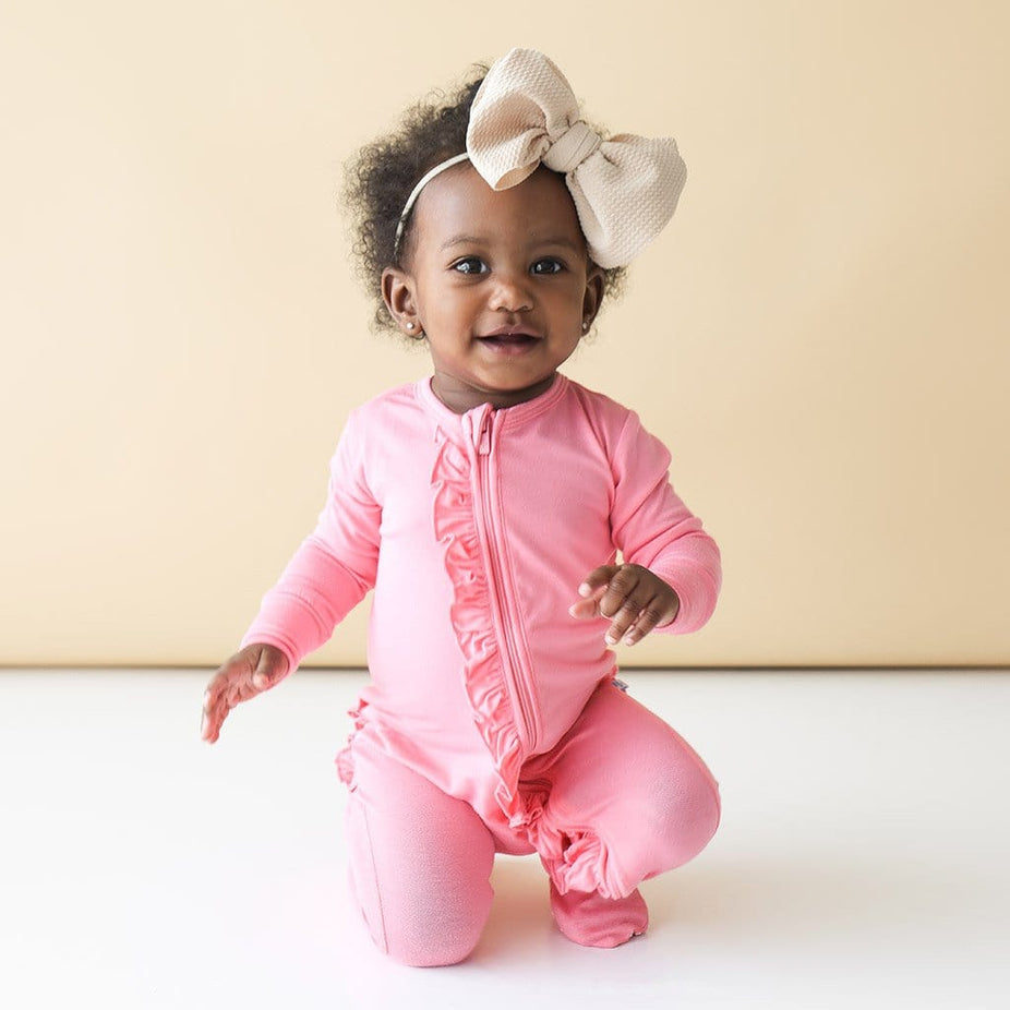 Baby wearing Blush Rose Footie Ruffled Zippered One Piece