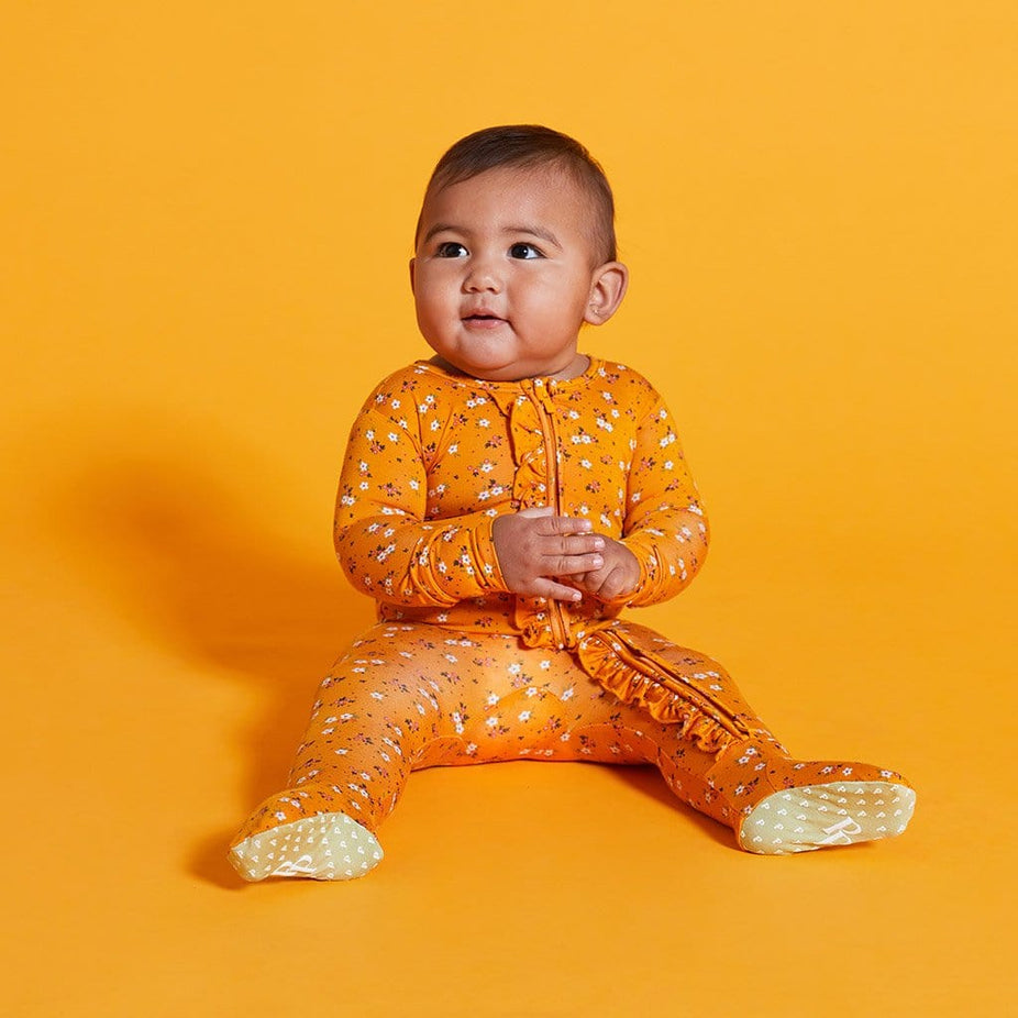 Baby wearing Halsey Footie Ruffled Zippered One Piece