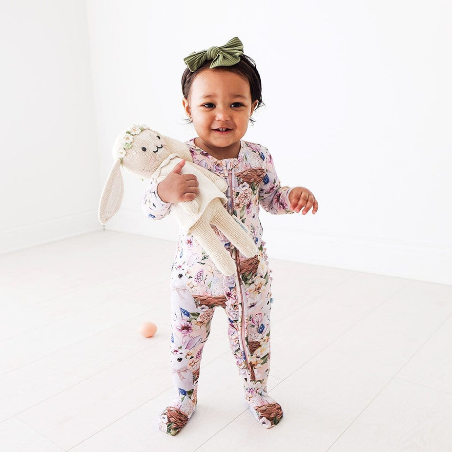 Baby wearing Hazel Footie Ruffled Zippered One Piece