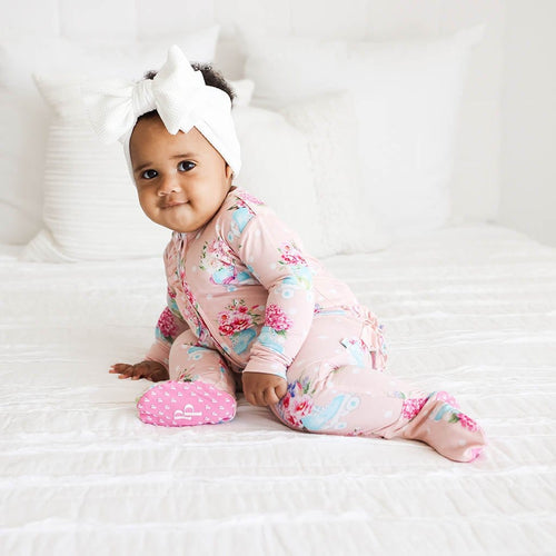 Baby wearing Jenny Footie Ruffled Zippered One Piece in flower print