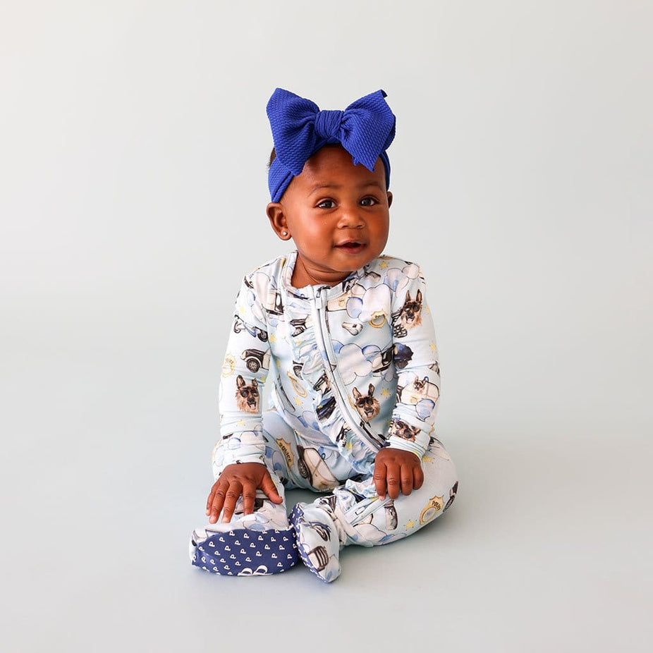 Baby wearing Police Footie Ruffled Zippered One Piece