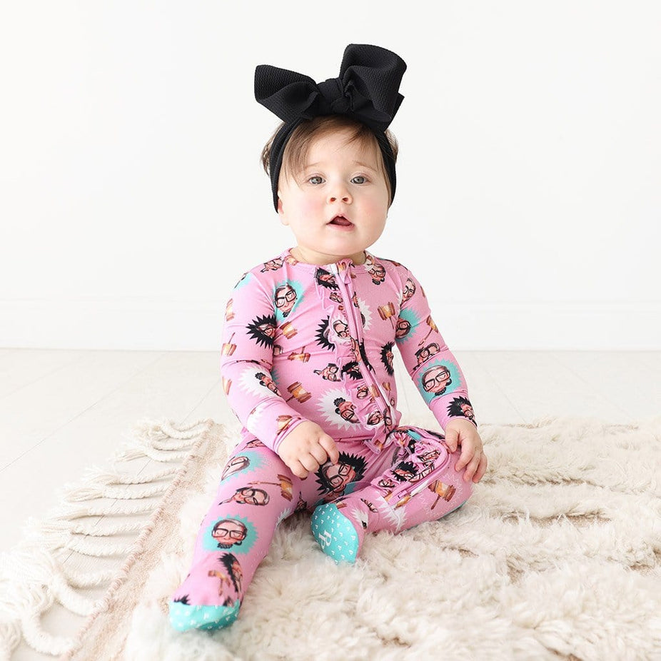Baby on Ruth Bader Ginsburg Footie Ruffled Zippered One Piece