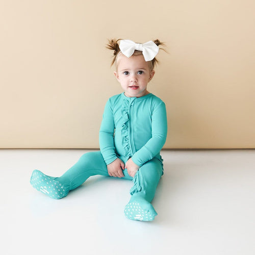 Baby on Signature Teal Footie Ruffled Zippered One Piece