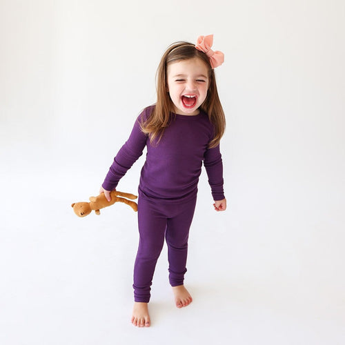 toddler girl in Posh Peanut Plum Waffle Knit long sleeve toddler pajamas