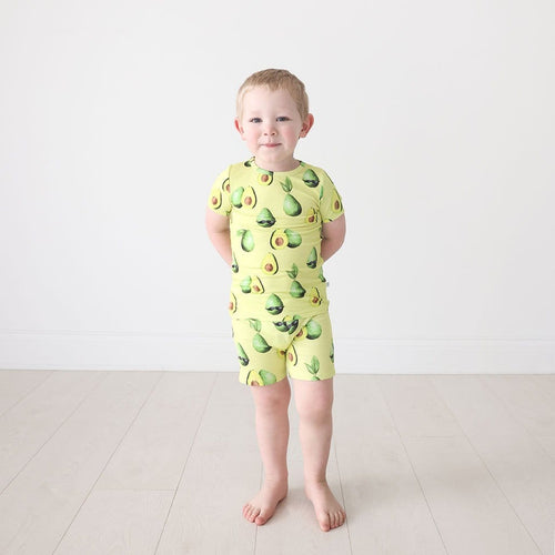 Toddler boy wearing Franco Short Sleeve Short Pajamas in avocado print
