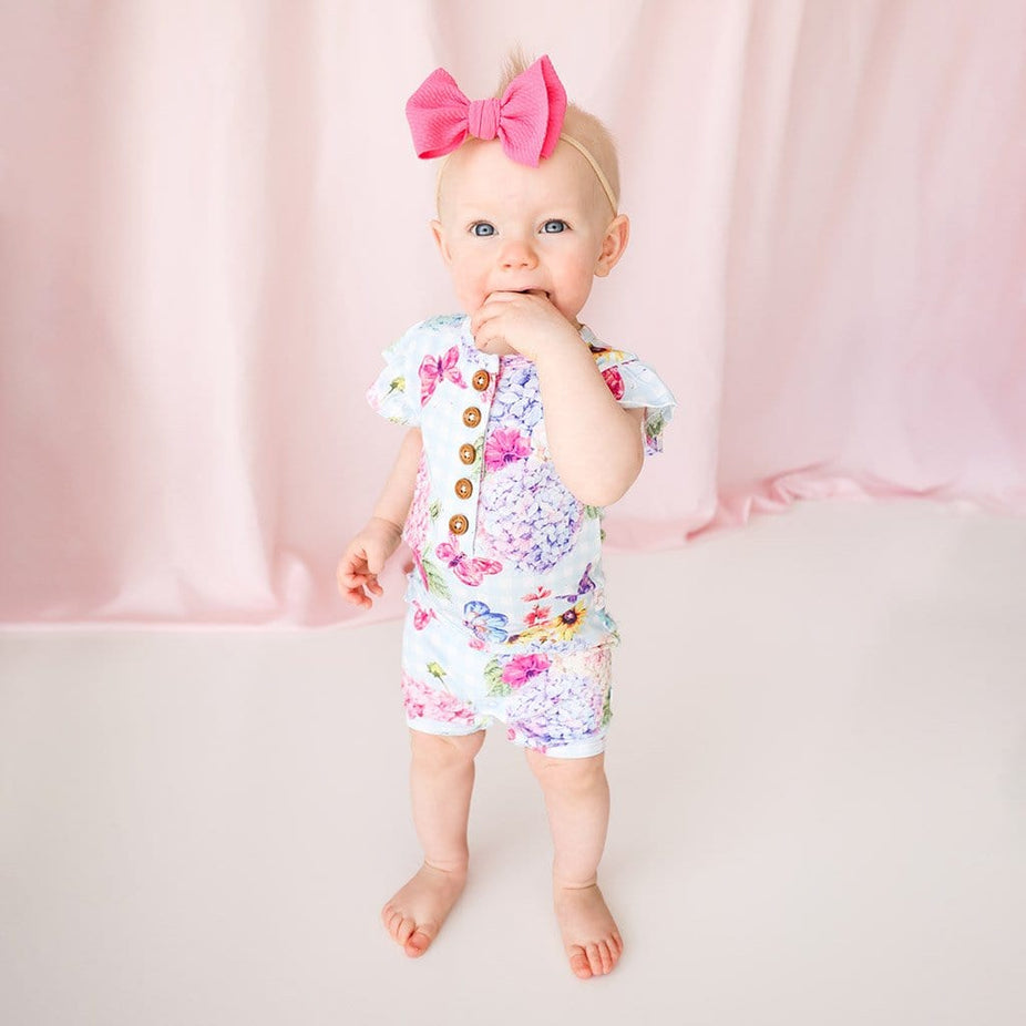 Baby on Nicolette Ruffled Cap Sleeve Henley Short Romper