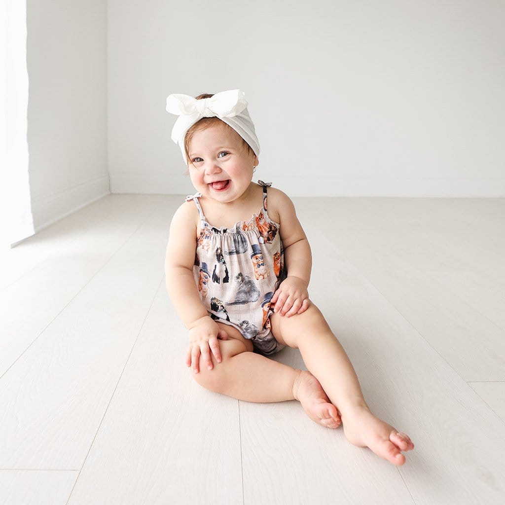 Baby wearing Collyns Sleeveless Bubble Romper