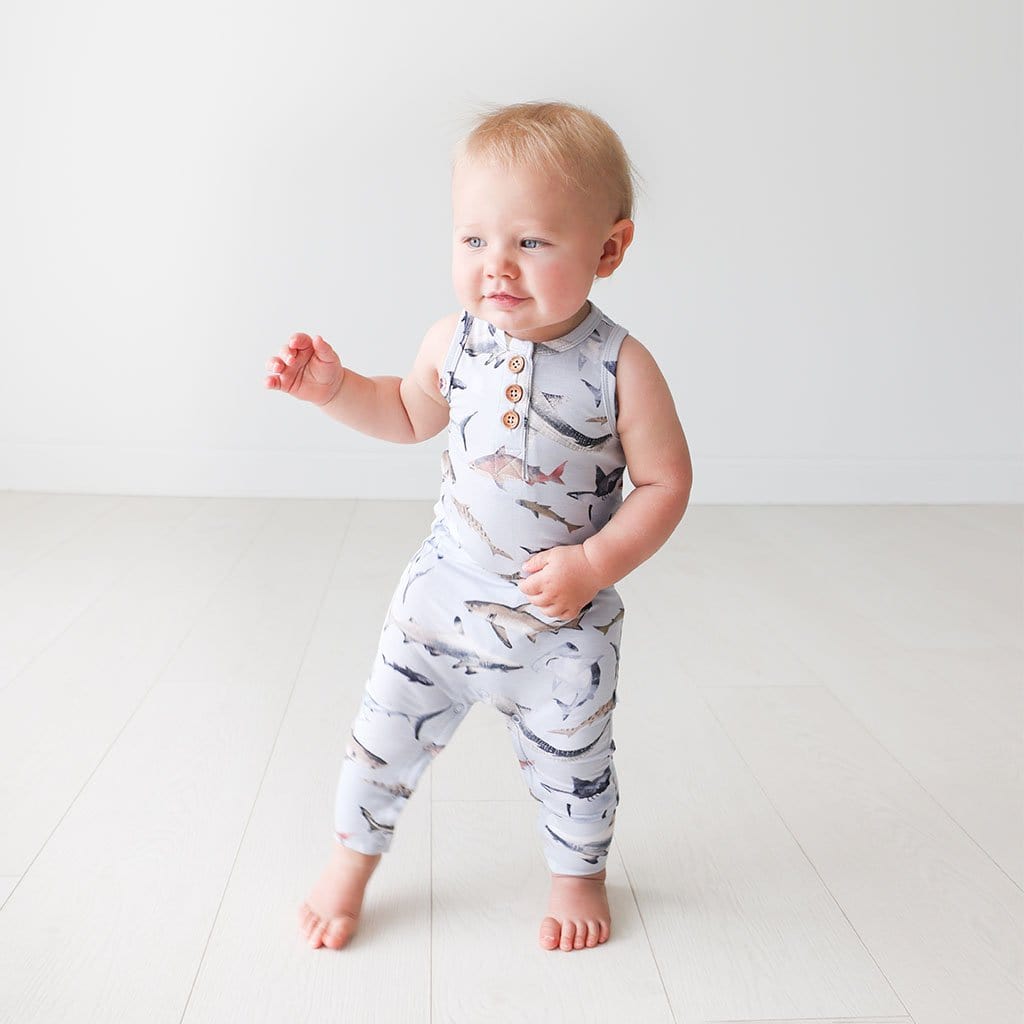 Baby wearing Maverick Racerback Henley Romper in shark print