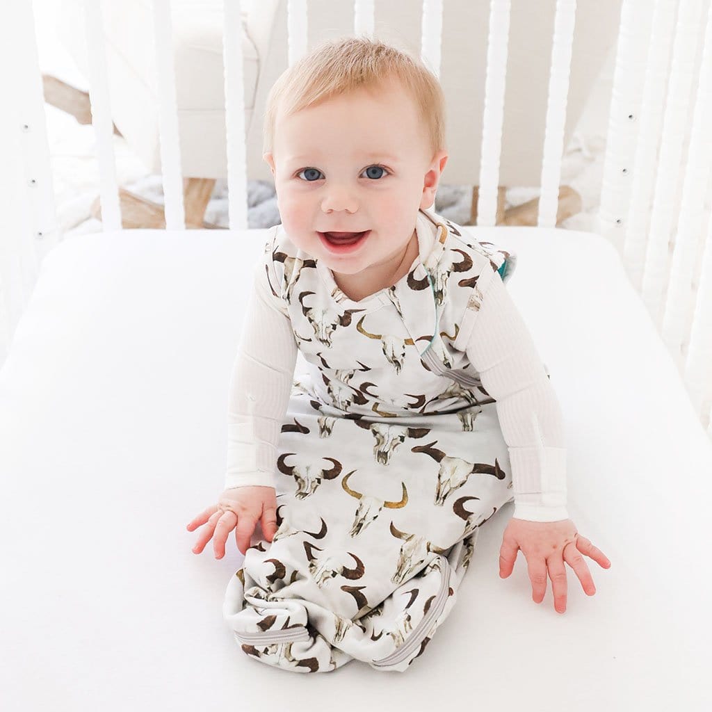 Baby on crib wearing Austin Sleeveless Sleep Bag 1.0 Tog