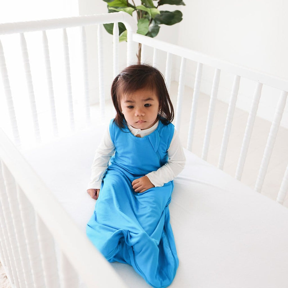Baby girl wearing Hawaiian Blue Sleeveless Sleep Bag 2.5 Tog
