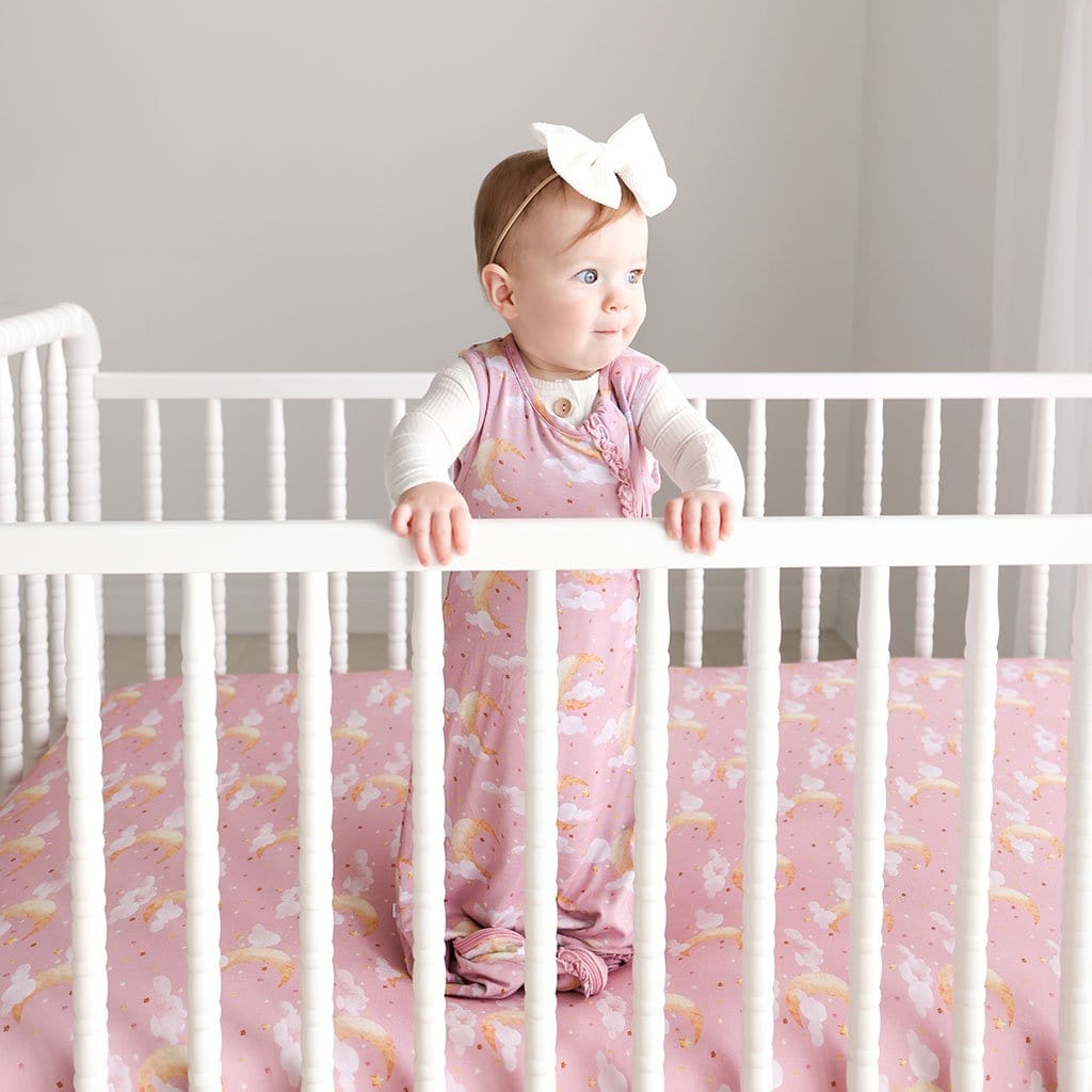 Baby Girl In Crib with Moon Pink Baby Sleep Sack 1.0 Tog