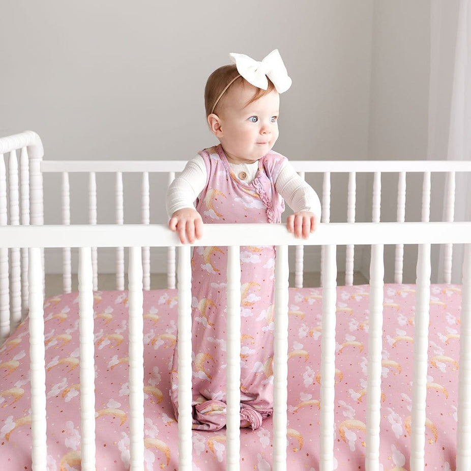Baby Girl In Crib with Moon Pink Baby Sleep Sack 1.0 Tog