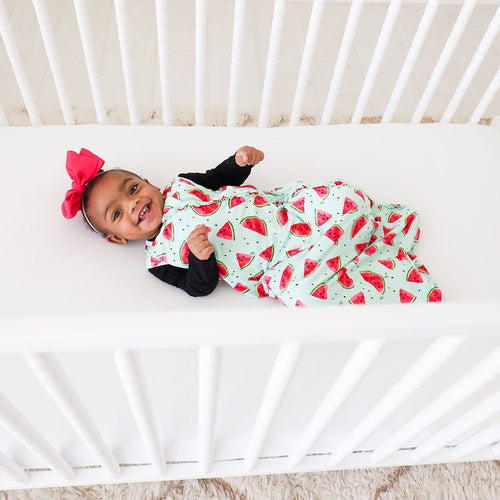 Baby in bed wearing Mellony Sleeveless Ruffled Sleep Bag 2.5 Tog