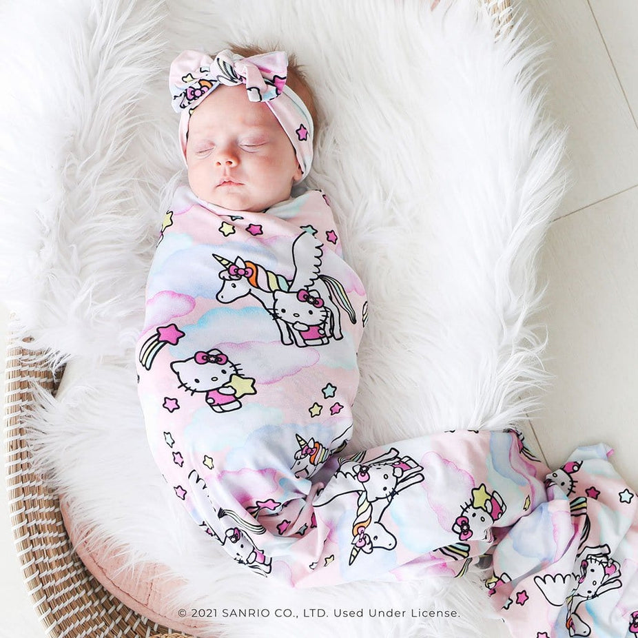 Baby on Hello Kitty® Unicorn Swaddle Headband Set