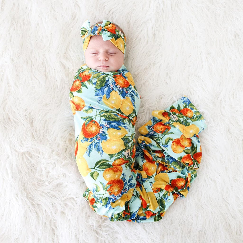 Baby wearing Lucia Swaddle Headband Set