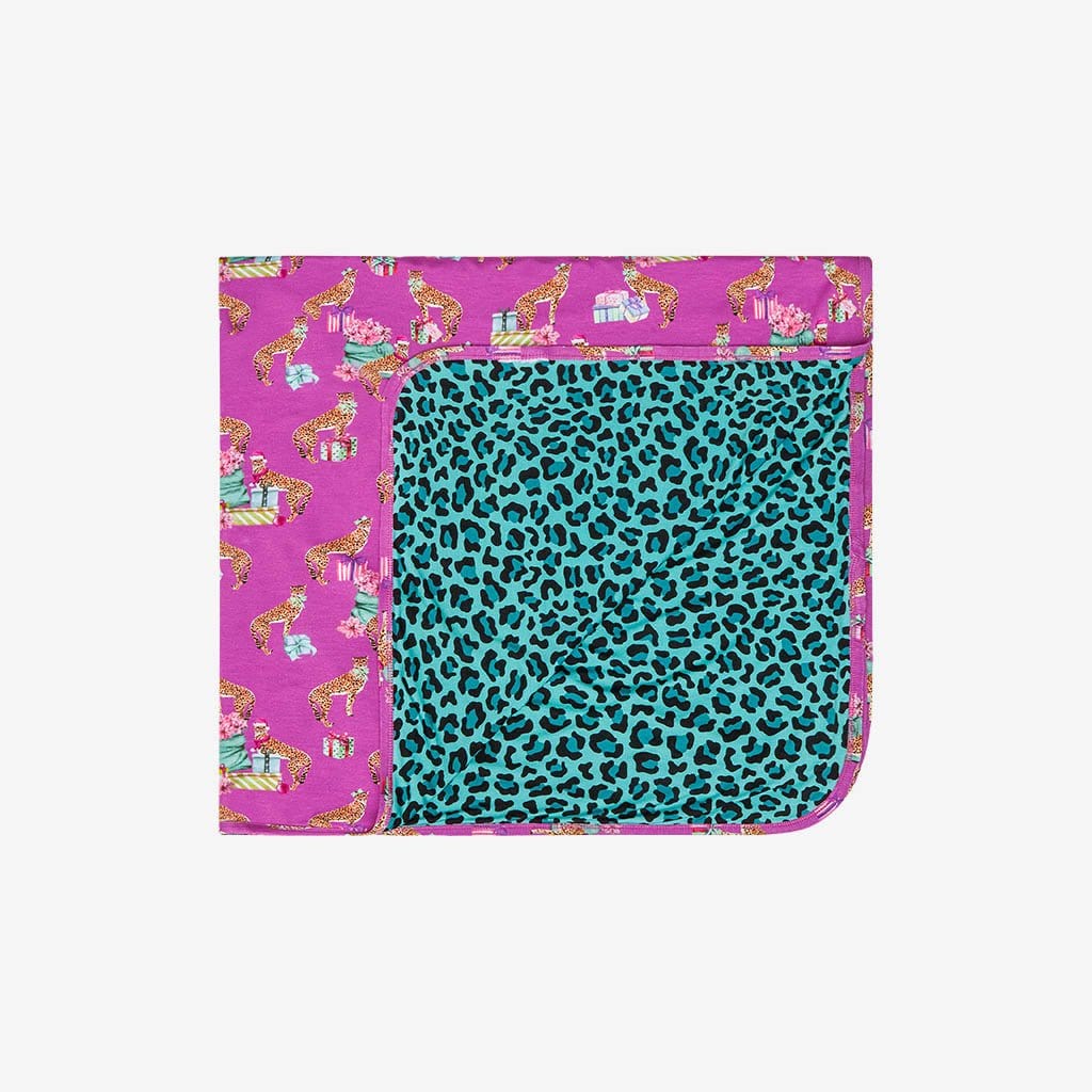 Front side Folded to show the reversible side of Patoo™ Leopard Baby Blanket | Keana & Whitney