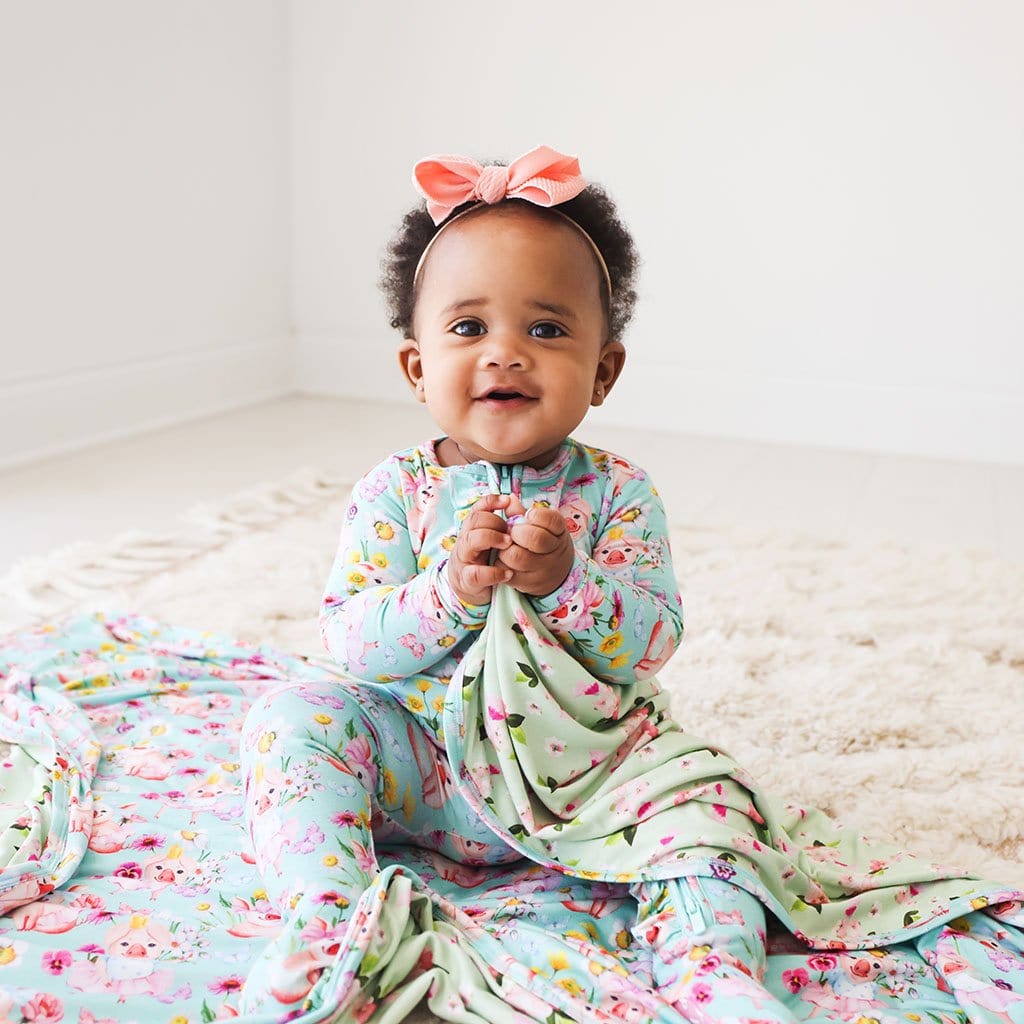 Baby on Missy & Sylvie Patoo with floral print