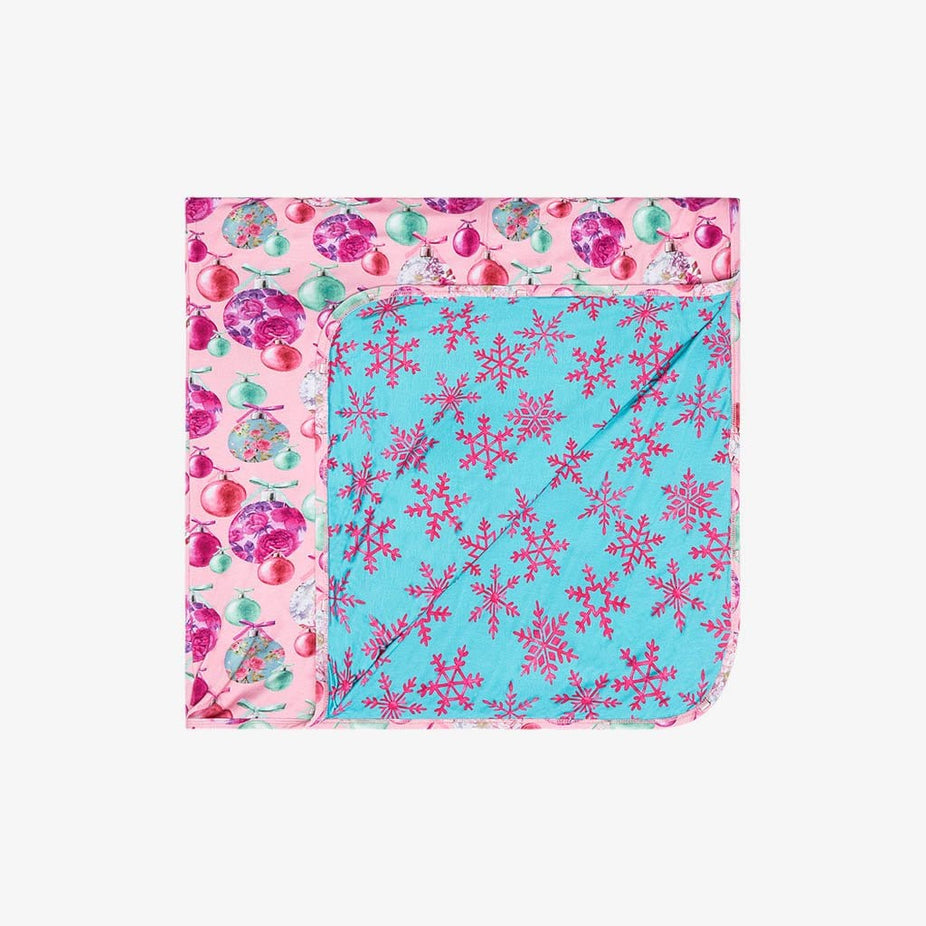 Folded to show the other side of Patoo™ Baby Blanket | Posh Ornaments & Queen of Snowflakes