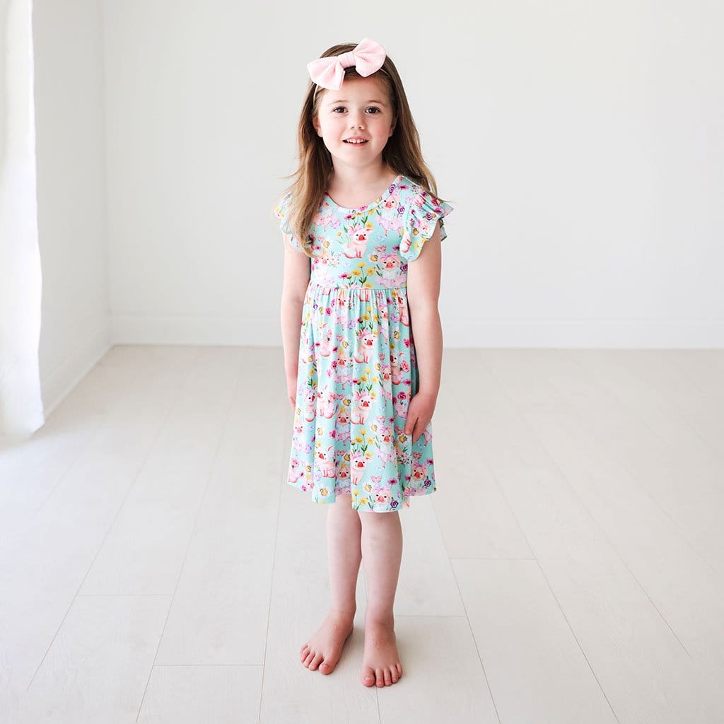 Toddler firl wearing Missy Ruffled Cap Sleeve Twirl Dress