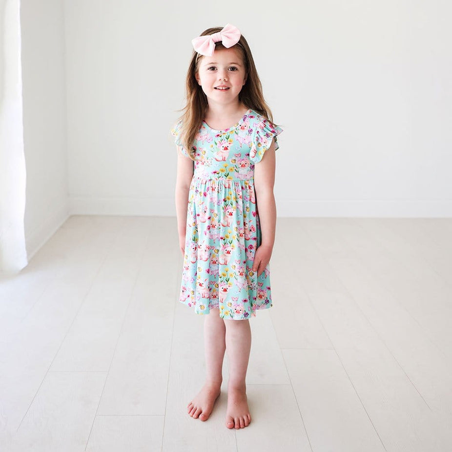 Toddler firl wearing Missy Ruffled Cap Sleeve Twirl Dress